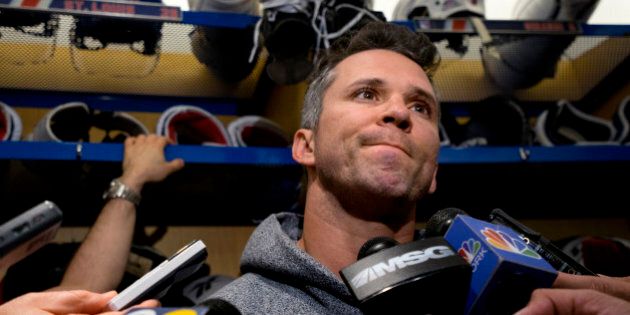 New York Rangers Martin St. Louis answers a reporter's question in the locker room at the team's Westchester training facility in Greenburgh, N.Y., Monday, June 1, 2015. The Rangers came up a game short of making the Stanley Cup finals for the second straight year. (AP Photo/Craig Ruttle)