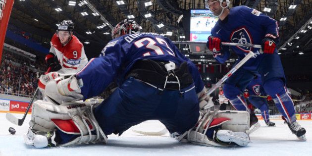 2016 IIHF World Championship - Group B - Canada v France - St. Petersburg, Russia - 16/5/16 - Matt Duchene of Canada in action with goalkeepr Ronan Quemener of France. REUTERS/Konstantin Chalabov/Pool