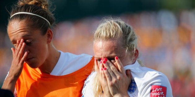 EDMONTON, AB - JULY 01: Laura Bassett of England is comforted by Jo Potter after the FIFA Women's World Cup Semi Final match between Japan and England at the Commonwealth Stadium on July 1, 2015 in Edmonton, Canada. (Photo by Kevin C. Cox/Getty Images)