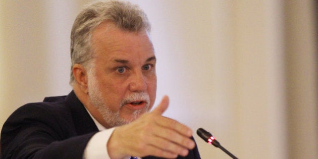 Premier Philippe Couillard of Quebec speaks at the New England Governors and eastern Canadian Premiers 38th annual conference Monday, July 14, 2014, in Bretton Woods, N.H. Energy and economic collaboration were the main topics at Sunday and Monday's conference. Eastern Canada is rich in hydropower while New England markets are eager to shore up supply and control some of the nation's highest energy costs. (AP Photo/Jim Cole)