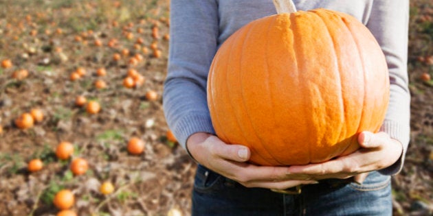 Woman holding pumpkin