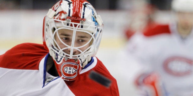 Montreal Canadiens goalie Dustin Tokarski skates during warmups before an NHL hockey game against the Minnesota Wild in St. Paul, Minn., Wednesday, Dec. 3, 2014. (AP Photo/Ann Heisenfelt)