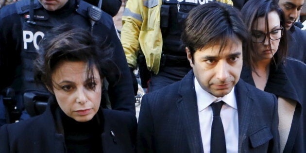 Jian Ghomeshi, a former celebrity radio host who has been charged with multiple counts of sexual assault, leaves the courthouse after the first day of his trial alongside his lawyer Marie Henein (L), in Toronto, February 1, 2016. REUTERS/Mark Blinch