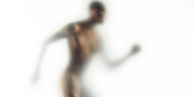 Naked young man walking (defocussed)