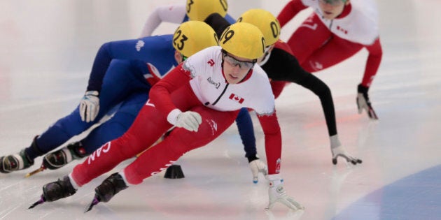 Marianne St-Gelais, of Canada, leads the field to win the women's 1500m short track final B at the Krylatskoye skating center during the short track world championships, in Moscow, Russia, on Saturday, March 14, 2015. (AP Photo/Ivan Sekretarev)