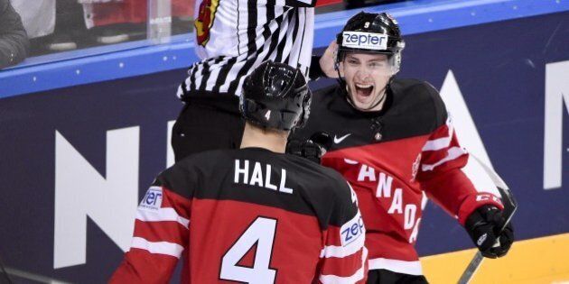 Forward Taylor Hall of Canada (L) celebrates with his teammate forward Matt Duchene after scoring a goal during the group A preliminary round ice hockey match Canada vs Germany of the IIHF International Ice Hockey World Championship on May 3, 2015 at the O2 Arena in Prague. AFP PHOTO / JONATHAN NACKSTRAND (Photo credit should read JONATHAN NACKSTRAND/AFP/Getty Images)