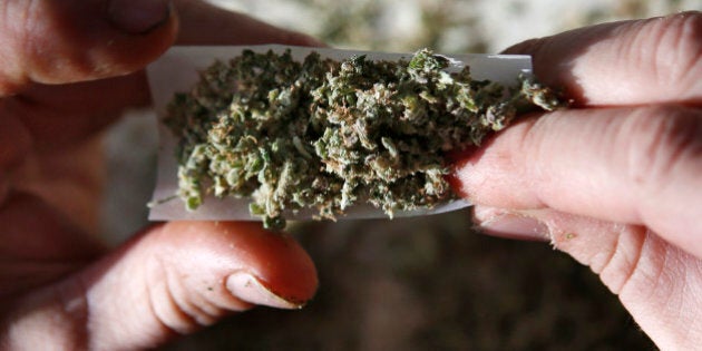 In this photo made Friday, Nov. 21, 2014, former U.S. Marine Sgt. Ryan Begin rolls a medical marijuana joint at his home in Belfast, Maine. The Pine Tree State might be high on marijuana in 2016, sparking a charge toward legalization that has previously been the province of western states. (AP Photo/Robert F. Bukaty)