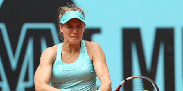 MADRID, SPAIN - MAY 03: Eugenie Bouchard of Canada plays a backhand against Barbora Strycova of the Czech Republic in their first round match during day two of the Mutua Madrid Open tennis tournament at the Caja Magica on May 3, 2015 in Madrid, Spain. (Photo by Clive Brunskill/Getty Images)