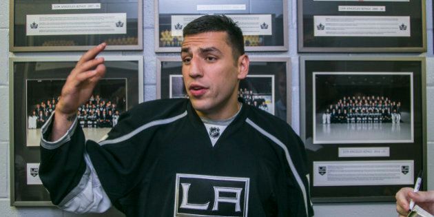 FILE - In this July 11, 2015, file photo, new Los Angeles Kings forward Milan Lucic takes questions from members of the media in El Segundo, Calif. The Kings, who acquired Lucic from Boston, were in need of help after missing the playoffs, and losing three regulars to off-ice legal problems. (AP Photo/Damian Dovarganes, File)