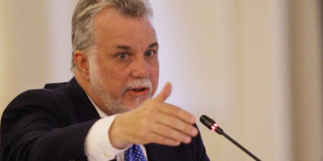 Premier Philippe Couillard of Quebec speaks at the New England Governors and eastern Canadian Premiers 38th annual conference Monday, July 14, 2014, in Bretton Woods, N.H. Energy and economic collaboration were the main topics at Sunday and Monday's conference. Eastern Canada is rich in hydropower while New England markets are eager to shore up supply and control some of the nation's highest energy costs. (AP Photo/Jim Cole)