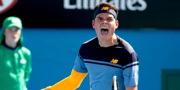 Milos Raonic of Canada celebrates after defeating Tommy Robredo of Spain in their second round match at the Australian Open tennis championships in Melbourne, Australia, Thursday, Jan. 21, 2016.(AP Photo/Vincent Thian)