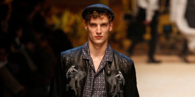 A model wears a creation for men's Fall-Winter 2016-2017 collection, part of the Milan Fashion Week, unveiled in Milan, Italy, Saturday, Jan. 16, 2016. (AP Photo/Luca Bruno)