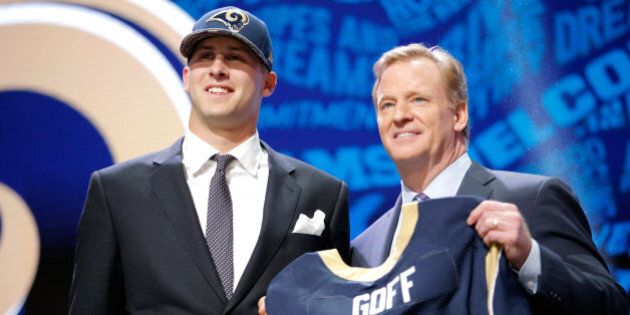 CHICAGO, IL - APRIL 28: (L-R) Jared Goff of the California Golden Bears holds up a jersey with NFL Commissioner Roger Goodell after being picked #1 overall by the Los Angeles Rams during the first round of the 2016 NFL Draft at the Auditorium Theatre of Roosevelt University on April 28, 2016 in Chicago, Illinois. (Photo by Jon Durr/Getty Images)