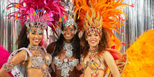 Three Samba dancers in Carnival costume