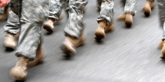 U.S. army soldiers are seen marching in the St. Patrick's Day Parade in New York, March 16, 2013. REUTERS/Carlo Allegri (UNITED STATES - Tags: SOCIETY)