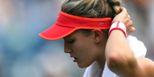 NEW YORK, NY - SEPTEMBER 04: Eugenie Bouchard reacts against Dominika Cibulkova of Slovakia during their Women's Singles Third Round match on Day Five of the 2015 US Open at the USTA Billie Jean King National Tennis Center on September 4, 2015 in the Flushing neighborhood of the Queens borough of New York City. (Photo by Clive Brunskill/Getty Images)