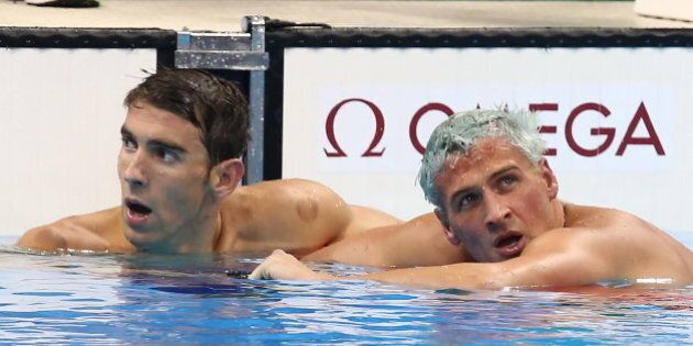 RIO DE JANEIRO, BRAZIL - AUGUST 11, 2016: Michael Phelps (L) and Ryan Lochte of the United States look on after the men's 200m individual medley final at the Rio 2016 Summer Olympic Games, at the Olympic Aquatics Stadium. It is 22nd Olympic gold for Phelps. Stanislav Krasilnikov/TASS (Photo by Stanislav Krasilnikov\TASS via Getty Images)