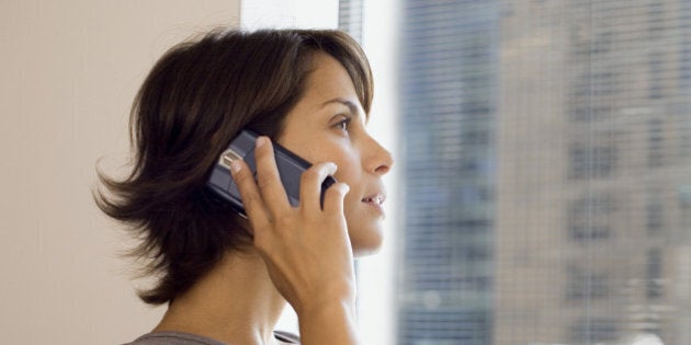 Businesswoman using cell phone