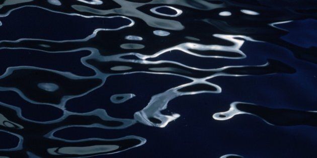 circa 1980: The rippled surface of a dark pool bends the light to form a wavy pattern. (Photo by Ernst Haas/Ernst Haas/Getty Images)