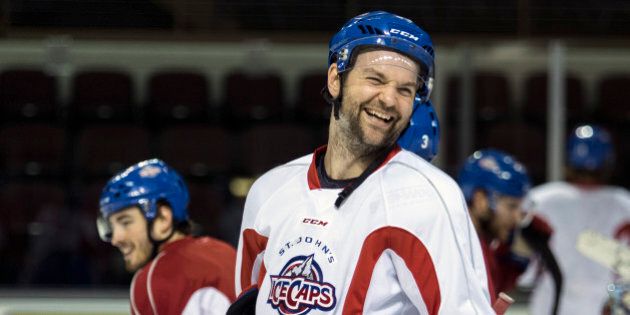 PORTLAND, ME - JANUARY 26: John Scott, (cq) a 6-foot-8 brawler type hockey player, shares a laugh with his teammates as he practices with the St. John's Ice Caps, an AHL affiliate of the Montreal Canadians, at the Cumberland County Civic Center in Portland Tuesday, January 26, 2016. Scott, who has just five goals in an eight-year NHL career, has racked up 592 penalty minutes as he's earned a reputation for fighting. As somewhat of a joke among fans he was voted in as a captain in the upcoming NHL All-Star game. (Photo by Gabe Souza/Portland Press Herald via Getty Images)