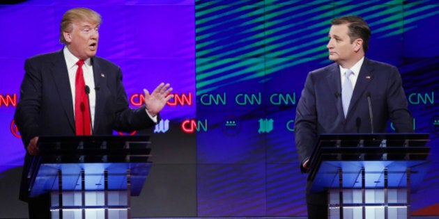 Republican presidential candidate, businessman Donald Trump, speaks as Republican presidential candidate, Sen. Ted Cruz, R-Texas, listens during a Republican presidential debate sponsored by CNN, Salem Media Group and the Washington Times at the University of Miami, Thursday, March 10, 2016, in Coral Gables, Fla. (AP Photo/Wilfredo Lee)