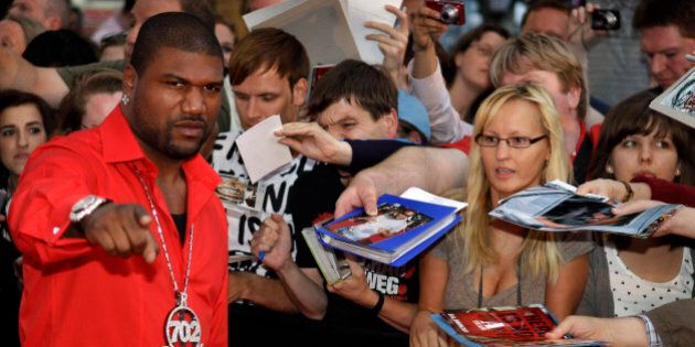 US actor Quinton 'Rampage' Jackson, left, arrives for a VIP preview of the movie A-Team in Berlin, Germany, Thursday, July 29, 2010. (AP Photo/Michael Sohn)