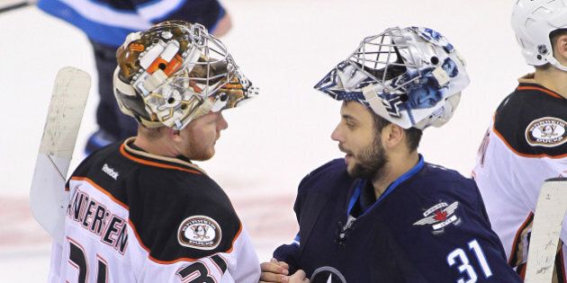 WINNIPEG, MB - APRIL 22: Frederik Andersen #31 of the Anaheim Ducks and Ondrej Pavelec #31 of the Winnipeg Jets greet each other after the Anaheim Ducks defeated the Winnipeg Jets in Game Four of the Western Conference Quarterfinals during the 2015 NHL Stanley Cup Playoffs at the MTS Centre on April 22, 2015 in Winnipeg, Manitoba, Canada. (Photo by Marianne Helm/Getty Images)