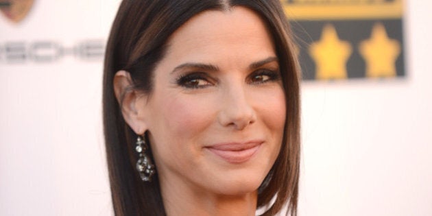 Sandra Bullock arrives at the 19th annual Critics' Choice Movie Awards at the Barker Hangar on Thursday, Jan. 16, 2014, in Santa Monica, Calif. (Photo by Jordan Strauss/Invision/AP)