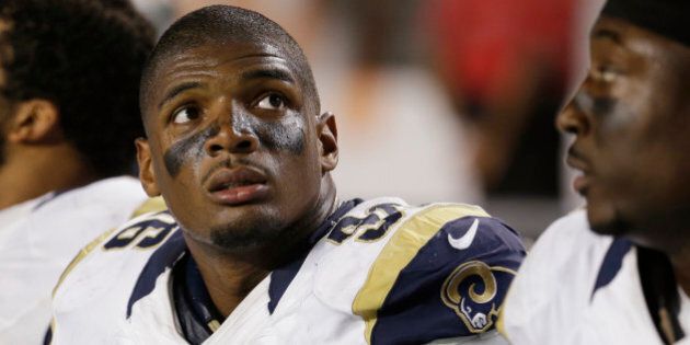 St. Louis Rams defensive end Michael Sam (96) looks up at the scoreboard from the sidelines during the first half of an NFL preseason football game against the Miami Dolphins, Thursday, Aug. 28, 2014 in Miami Gardens, Fla. The Dolphins defeated the Rams 14-13. (AP Photo/Lynne Sladky)