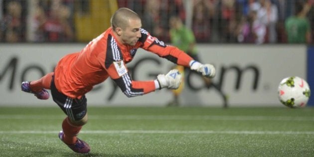 Impact of Montreal Goal Keeper Evan Bush defends against Liga Deportiva Alajuelense during their Concacaf Champions League semifinal match in Alejandro Morera Soto stadium in Alajuela, 25km northwest of San Jose on April 7, 2015. AFP PHOTO/Ezequiel BECERRA (Photo credit should read EZEQUIEL BECERRA/AFP/Getty Images)