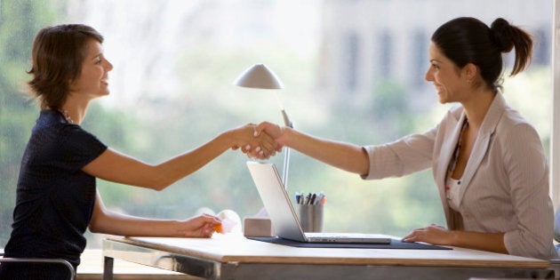 Businesswomen shaking hands