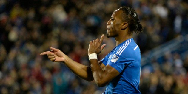 Oct 25, 2015; Montreal, Quebec, CAN; Montreal Impact forward Didier Drogba (11) reacts after scoring a goal against the Toronto FC during the second half at Stade Saputo. Mandatory Credit: Eric Bolte-USA TODAY Sports
