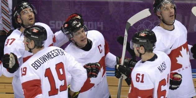 Canada's players celebrate after scoring during the Men's Ice Hockey Quarterfinals Canada vs Latvia at the Bolshoy Ice Dome during the Sochi Winter Olympics on February 19, 2014. AFP PHOTO / ALEXANDER NEMENOV (Photo credit should read ALEXANDER NEMENOV/AFP/Getty Images)