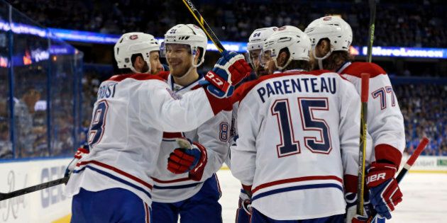TAMPA, FL - MAY 7: Members of the Montreal Canadiens Brandon Prust #8, Lars Eller #81, Greg Pateryn #64, P.A. Parenteau #15 and Tom Gilbert #77 celebrate a goal against the Tampa Bay Lightning in Game Four of the Eastern Conference Semifinals during the 2015 NHL Stanley Cup Playoffs at Amalie Arena on May 7, 2015 in Tampa, Florida. (Photo by Mike Carlson/Getty Images)