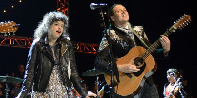MOUNTAIN VIEW, CA - OCTOBER 26: Regine Chassagne (L) and Win Butler of Arcade Fire perform as part of the 27th Annual Bridge School Benefit at Shoreline Amphitheatre on October 26, 2013 in Mountain View, California. (Photo by Tim Mosenfelder/Getty Images)