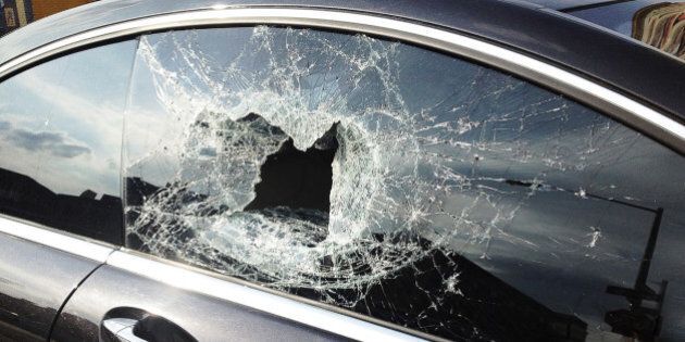 Smashed car window from recent theft in Brooklyn.