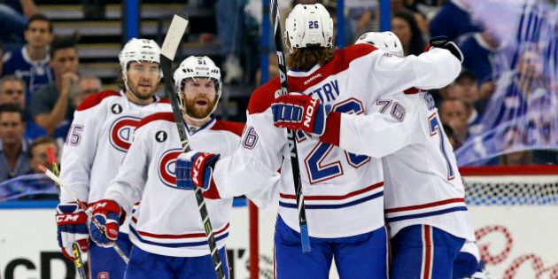 TAMPA, FL - MAY 7: Members of the Montreal Canadiens, including P.A. Parenteau #15, David Desharnais #51, Jeff Petry #26 and P.K. Subban #76 of the Montreal Canadiens celebrate a goal against the Tampa Bay Lightning in Game Four of the Eastern Conference Semifinals during the 2015 NHL Stanley Cup Playoffs at Amalie Arena on May 7, 2015 in Tampa, Florida. (Photo by Mike Carlson/Getty Images)