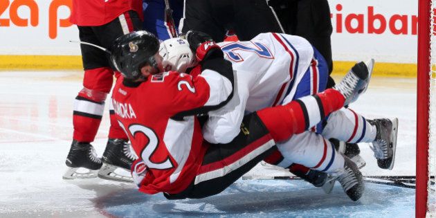 OTTAWA, ON - APRIL 19: Erik Condra #22 of the Ottawa Senators gets tackled to the ice by Jeff Petry #26 of the Montreal Canadiens in Game Three of the Eastern Conference Quarterfinals during the 2015 NHL Stanley Cup Playoffs at Canadian Tire Centre on April 19, 2015 in Ottawa, Ontario, Canada. (Photo by Jana Chytilova/Freestyle Photography/Getty Images)