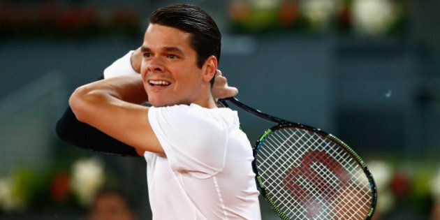 MADRID, SPAIN - MAY 07: Milos Raonic of Canada in action against Leonardo Mayer of Argentina during day six of the Mutua Madrid Open tennis tournament at the Caja Magica on May 7, 2015 in Madrid, Spain. (Photo by Julian Finney/Getty Images)