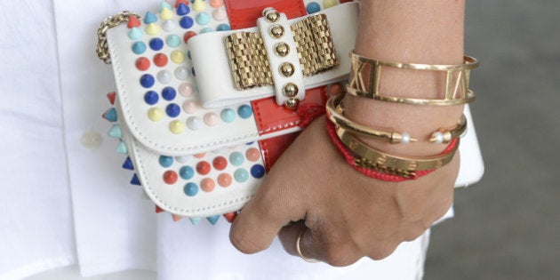 NEW YORK, NY - SEPTEMBER 03: Blogger Aimee Song (clutch and bracelet detail) front row at Kye - Mercedes-Benz Fashion Week Spring 2015 at Pier 59 on September 3, 2014 in New York City. (Photo by Vivien Killilea/Getty Images)