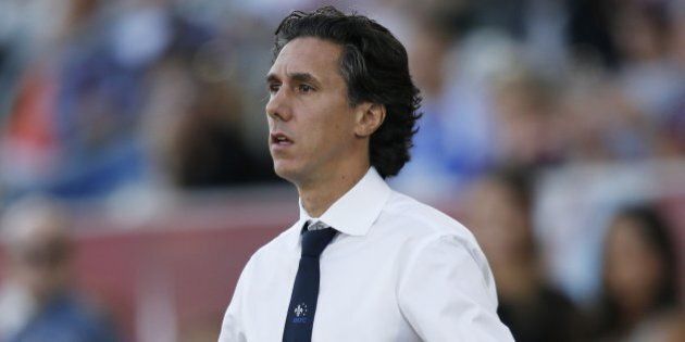Montreal Impact head coach Mauro Biello looks on in the first half of an MLS soccer match against the Colorado Rapids in Commerce City, Colo., Saturday, Oct. 10, 2015. (AP Photo/David Zalubowski)