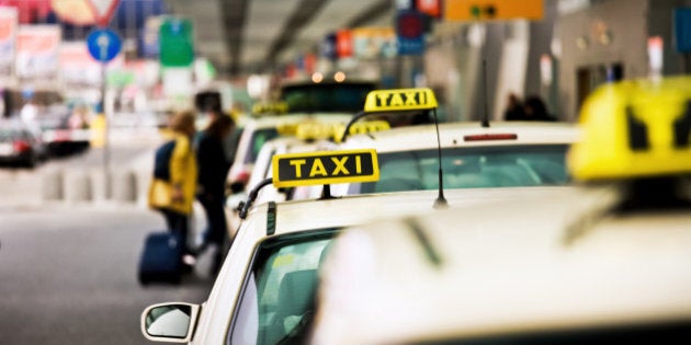 German Taxis at an airport in a row.