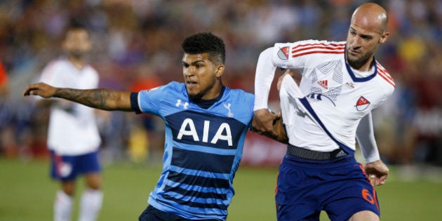 Tottenham Hotspur defender DeAndre Yedlin, left, battles for position with MLS All-Star defender Laurent Ciman during the second half of the MLS All-Star soccer game, Wednesday, July 29, 2015, in Commerce City, Colo. The MLS All-Stars won 2-1 in the 20th annual mid-season classic for the league. (AP Photo/David Zalubowski)