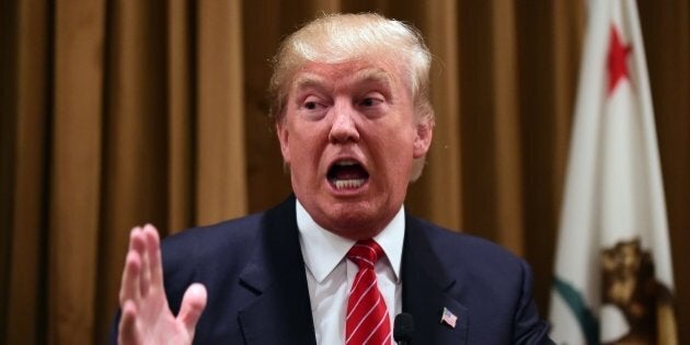 Donald Trump gestures at a press briefing where he introduced people whose families were victims of illegal immigrants on July 10, 2015 at the Beverly Wilshire Hotel in Beverly Hills, California, where some shared their stories of the loss of a loved one. The US business magnate Trump, who is running for President in the 2016 presidential elections, angered members of the Latino community with recent comments but says he will win the Latino vote. AFP PHOTO / FREDERIC J. BROWN (Photo credit should read FREDERIC J. BROWN/AFP/Getty Images)