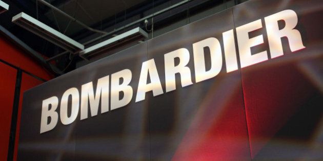 A Bombardier logo sits on a presentation platform at Bombardier Inc.'s Litchurch Lane railcar factory in Derby, U.K., on Thursday, May 15, 2014. Bombardier's transportation unit won $8 billion of new business in the first three months of 2014 and had a record backlog of $38.4 billion, including a $2.1 billion train deal with Transport for London. Photographer: Chris Ratcliffe/Bloomberg via Getty Images