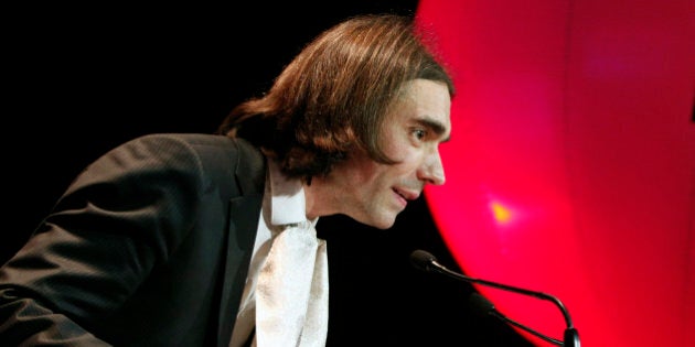 French mathematician Cedric Villani, delivers a speech before Socialist candidate for the election for the mayor of Paris, Anne Hidalgo, addresses her new year wishes to her support committee, in Paris, Monday, Jan. 13, 2014. Municipal elections will take place on March 23 and 30 throughout France. (AP Photo/Thibault Camus)