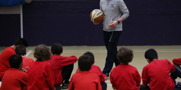 LONDON, ENGLAND - DECEMBER 01: Boys take part in a basketball lesson in the sports hall at a secondary school on December 1, 2014 in London, England. Education funding is expected to be an issue in the general election in 2015. (Photo by Peter Macdiarmid/Getty Images)