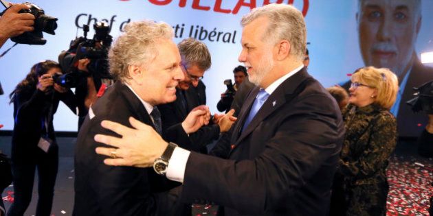 Philippe Couillard (R) is congratulated on his win as new leader of the Quebec Liberal Party by former leader Jean Charest in Montreal, March 17, 2013. REUTERS/Christinne Muschi (CANADA - Tags: POLITICS)