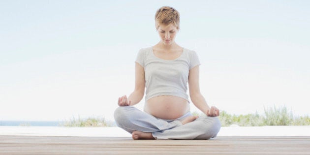 Pregnant woman doing yoga