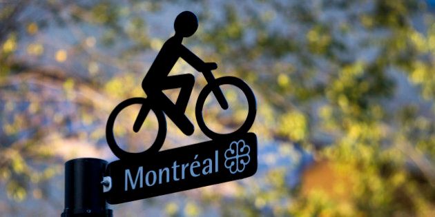 The Montreal logo is displayed on a bike lane sign in Montreal, Quebec, Canada, on Saturday, Nov. 5, 2011. Montreal is the largest city in the province of Quebec, the second-largest city in Canada and the seventh largest in North America. Photographer: Brent Lewin/Bloomberg via Getty Images